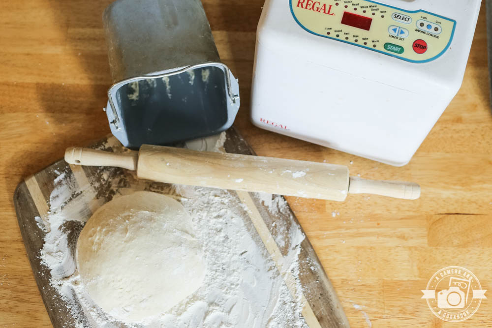 Pizza Dough You Can Toss {Bread Machine} - This bread machine Pizza Dough is easy and so good. It's also dough you can throw and toss just like the professionals.